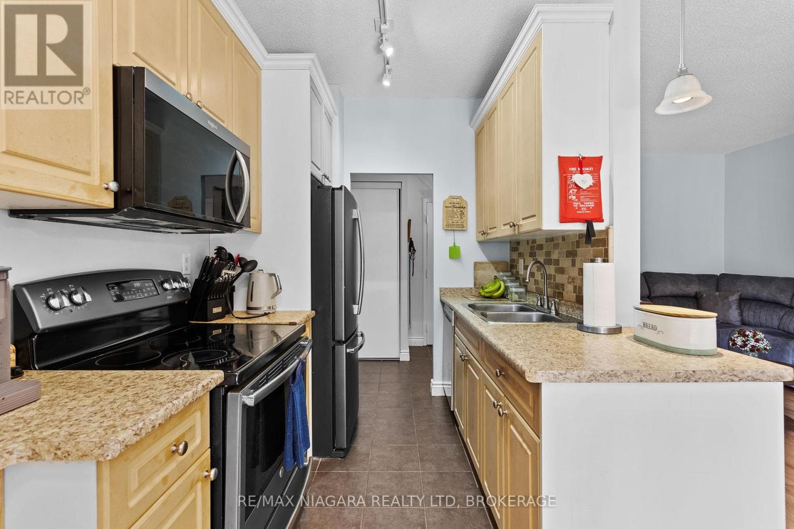 107 - 6390 HUGGINS STREET, Niagara — photo 5
